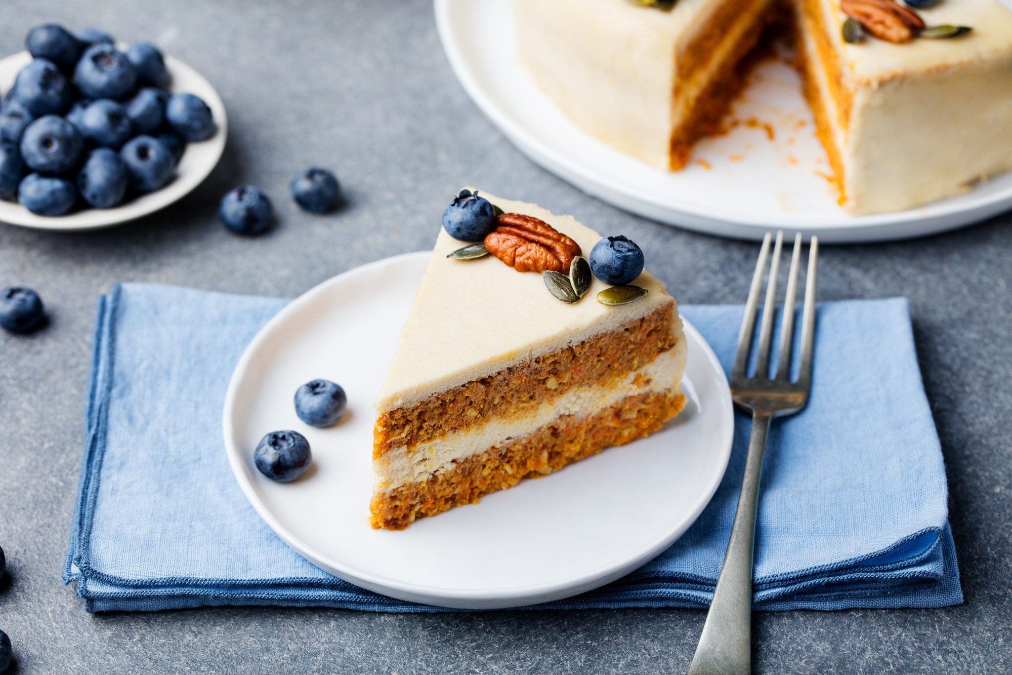 Vegan, Raw Carrot Cake on a White Plate. Healthy Food.