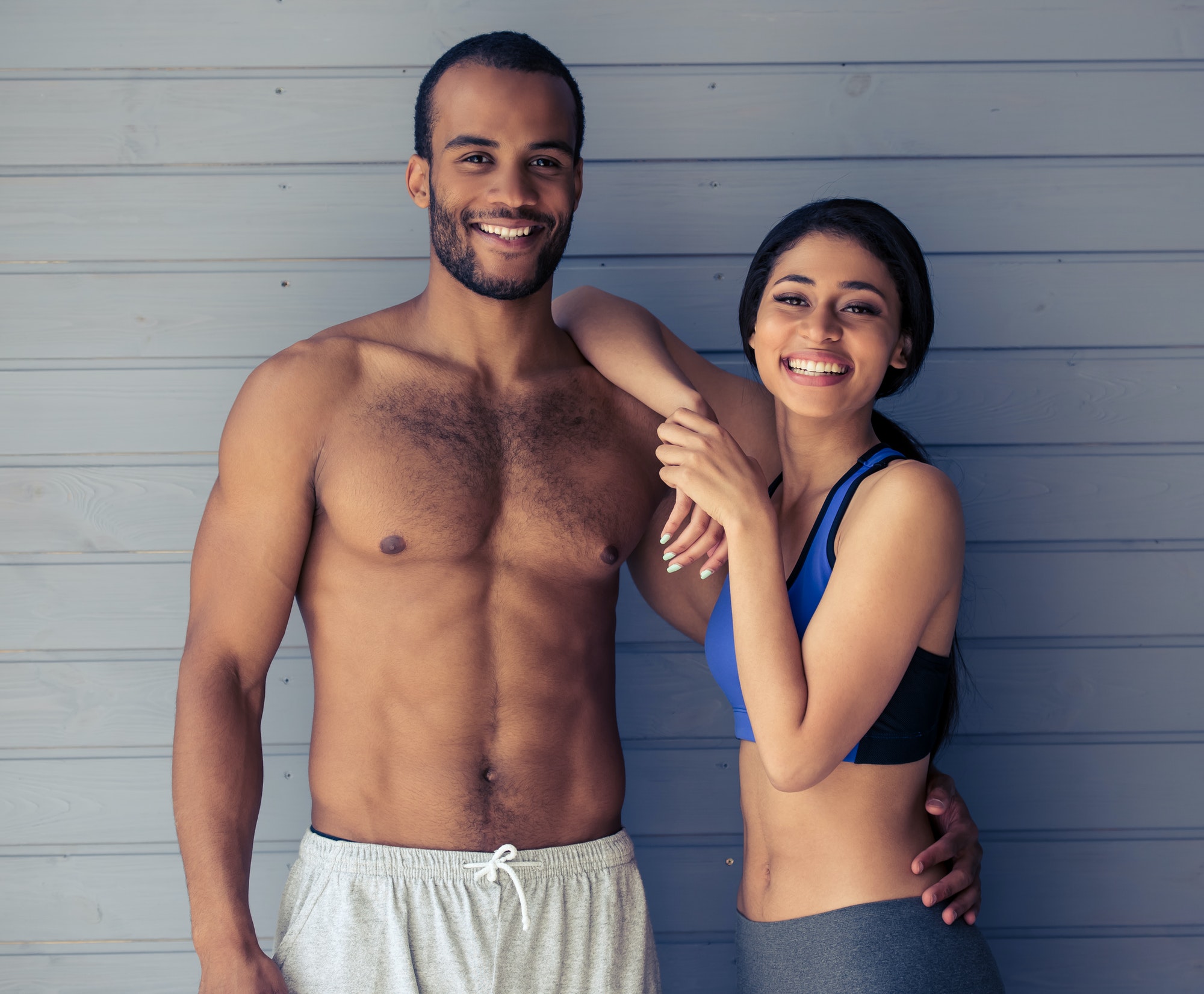 Beautiful Afro American couple finishing a core workout