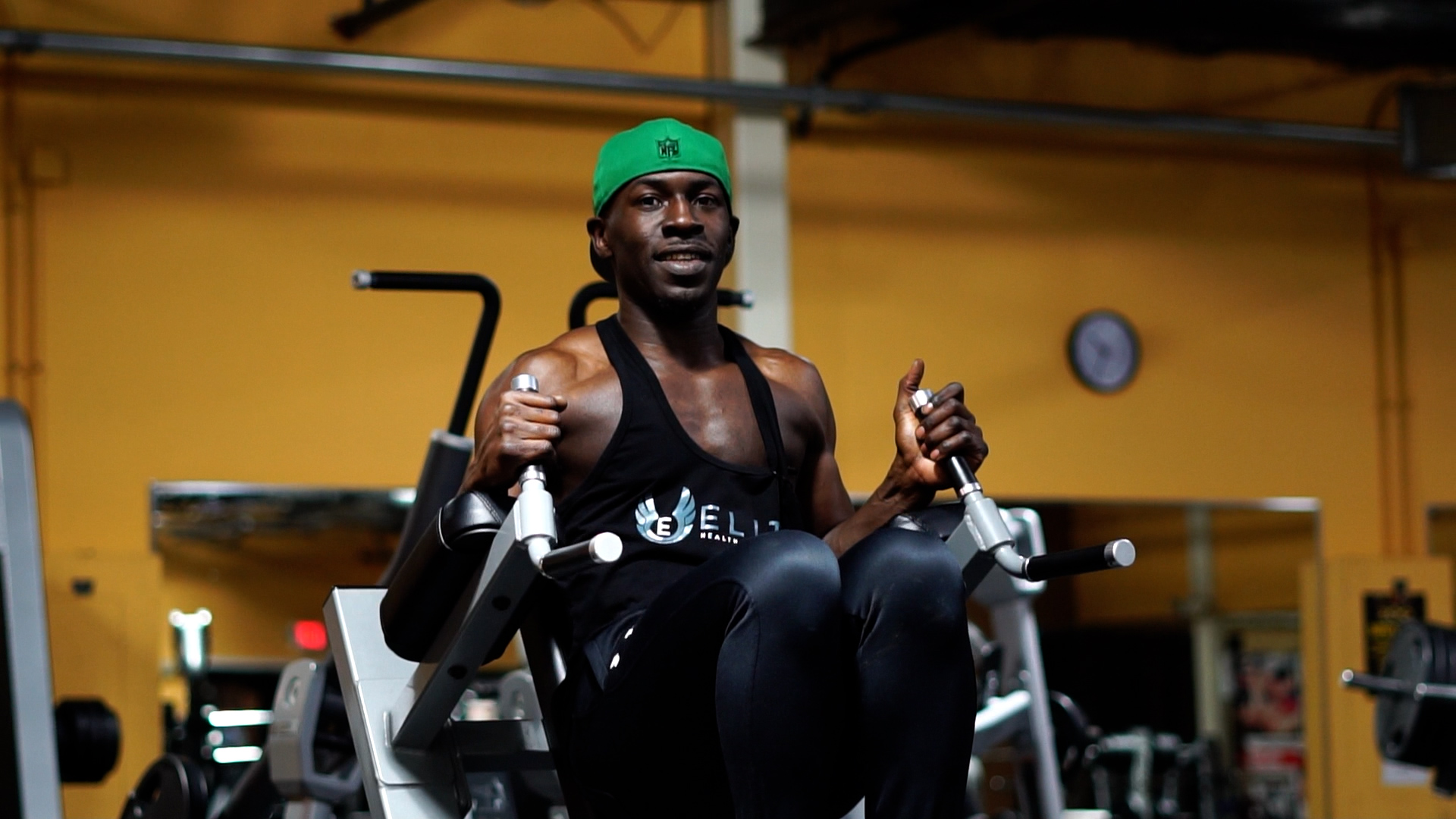 man doing weighted roman chair abs exercise